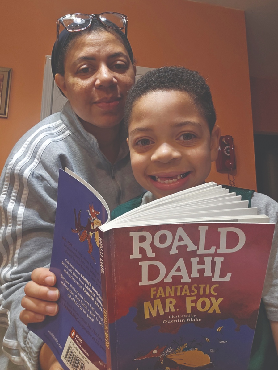 Child reading with parent