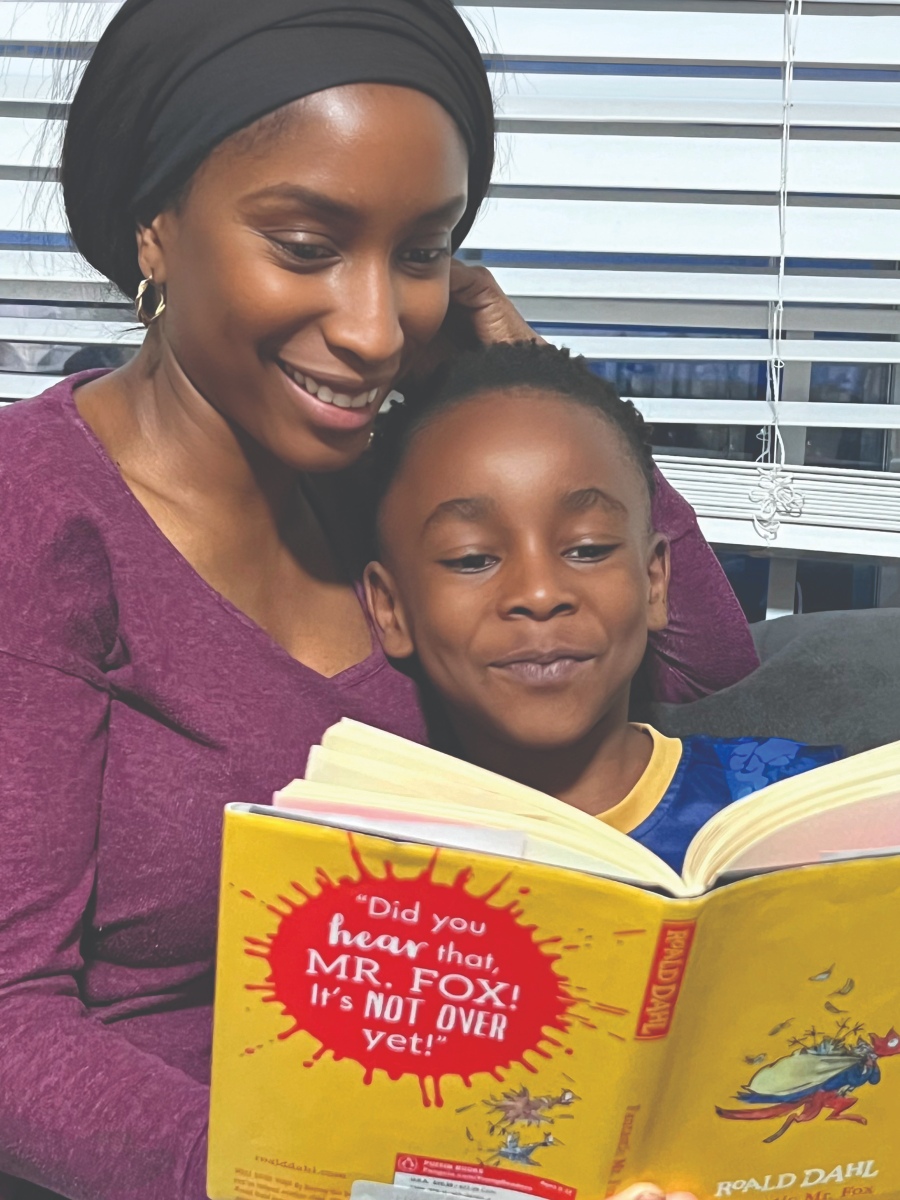 Child reading with parent