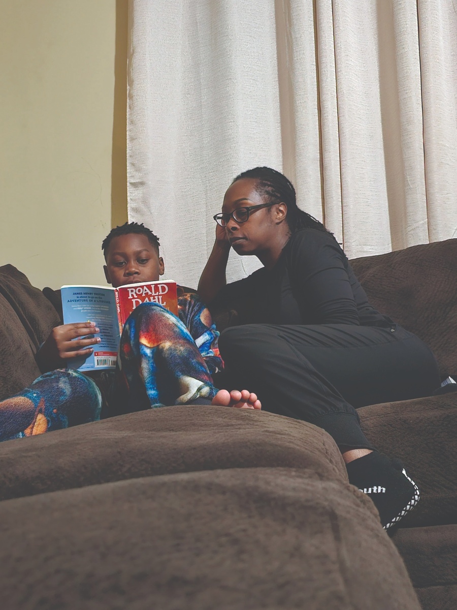 Child reading with parent