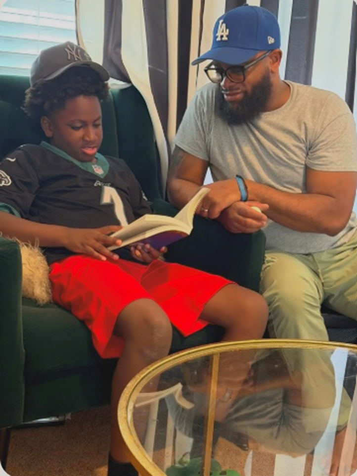 Child reading with parent