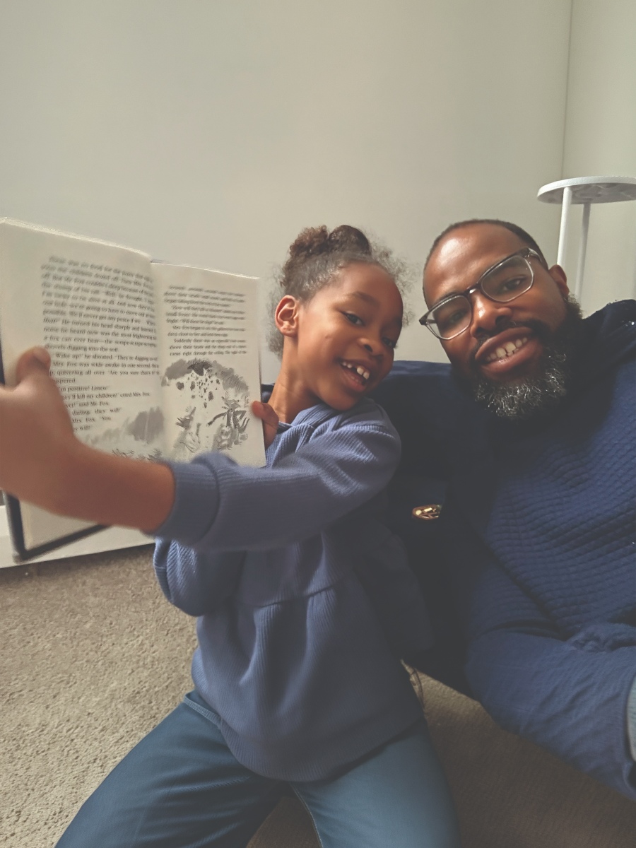 Child reading with parent