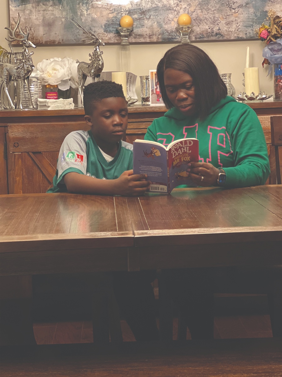 Child reading with parent