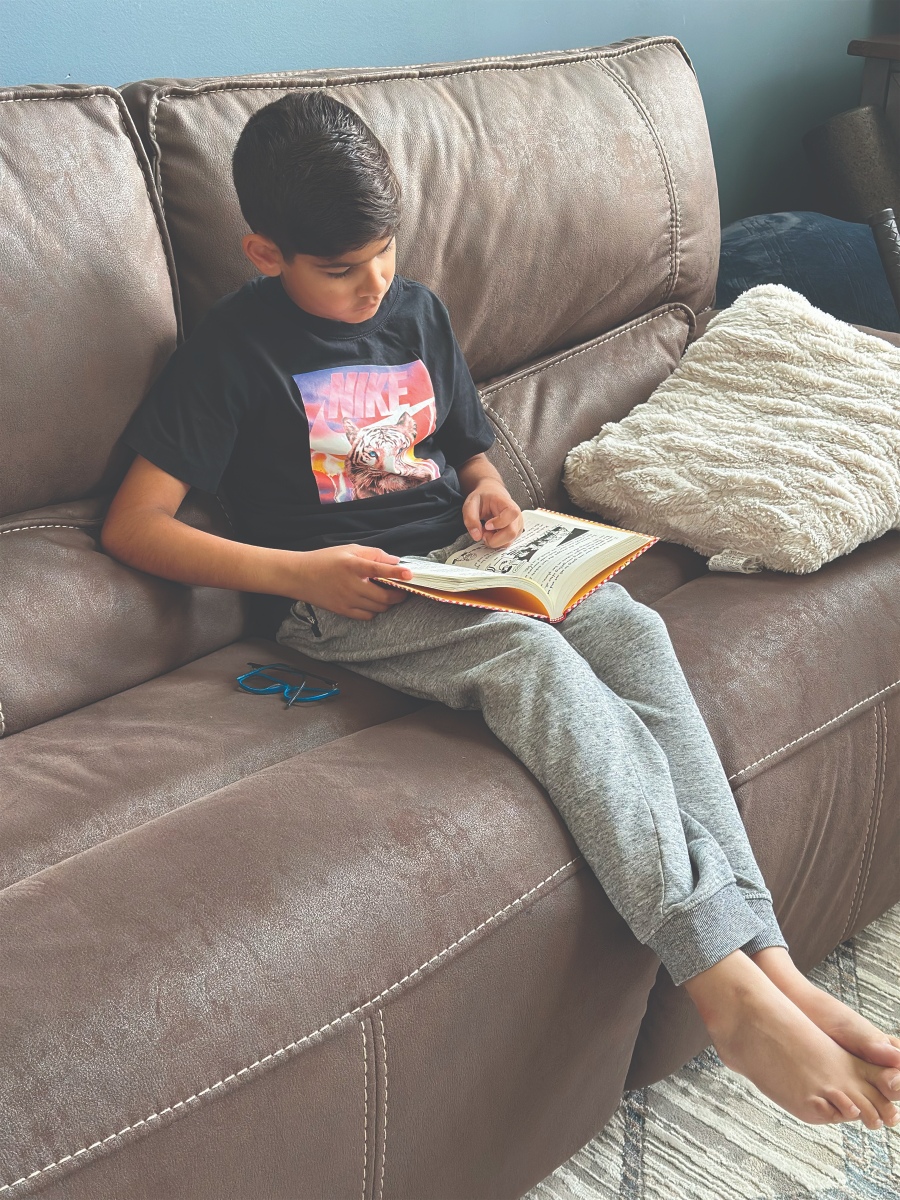Child reading with parent
